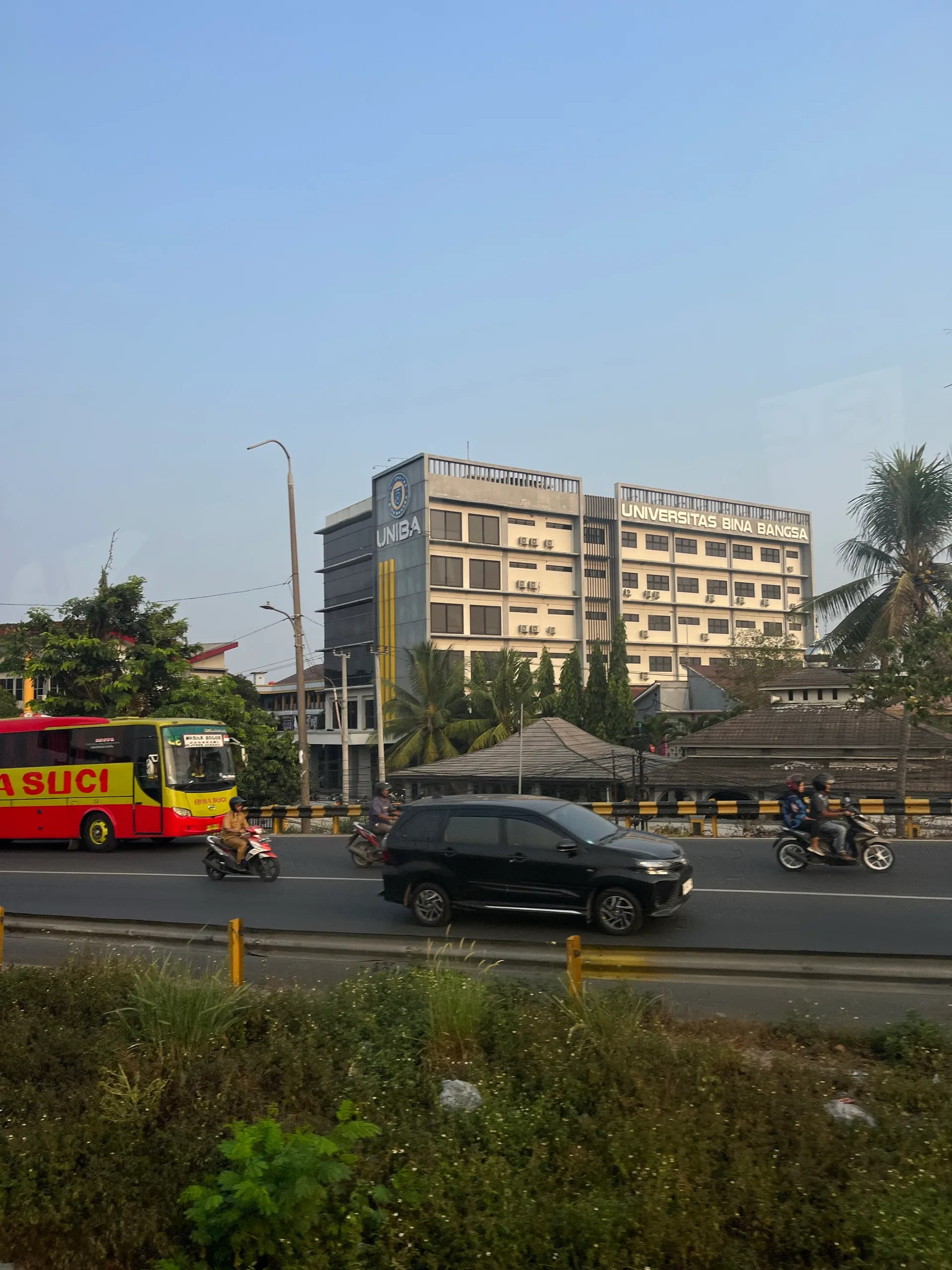 Universitas Bina Bangsa seen from the Damri bus window, minutes from home