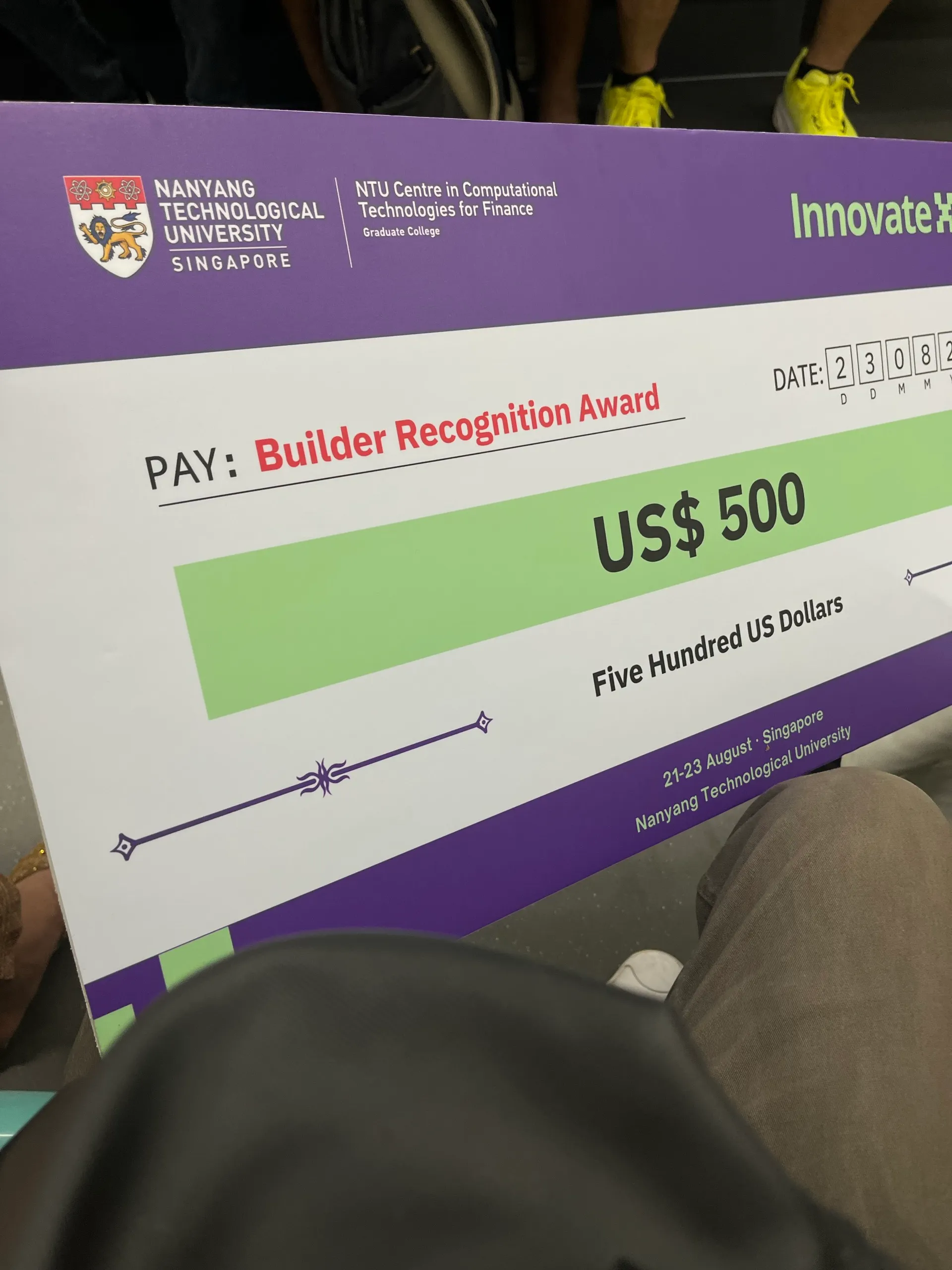 The Builder Recognition Award cheque for US$ 500, dated 23 August 2026, with no names printed on it