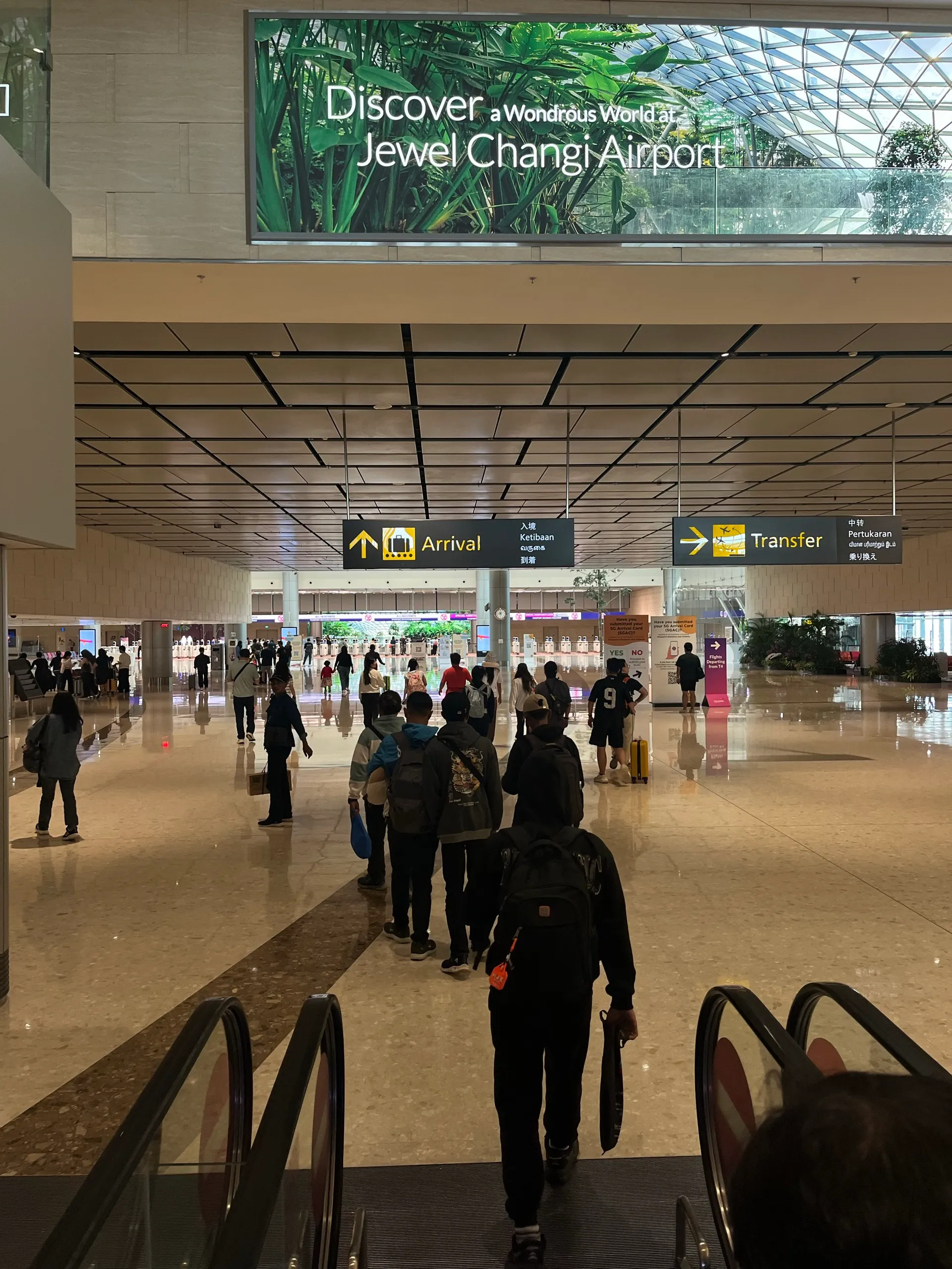 The arrival hall at Changi, with the Jewel Changi Airport sign overhead