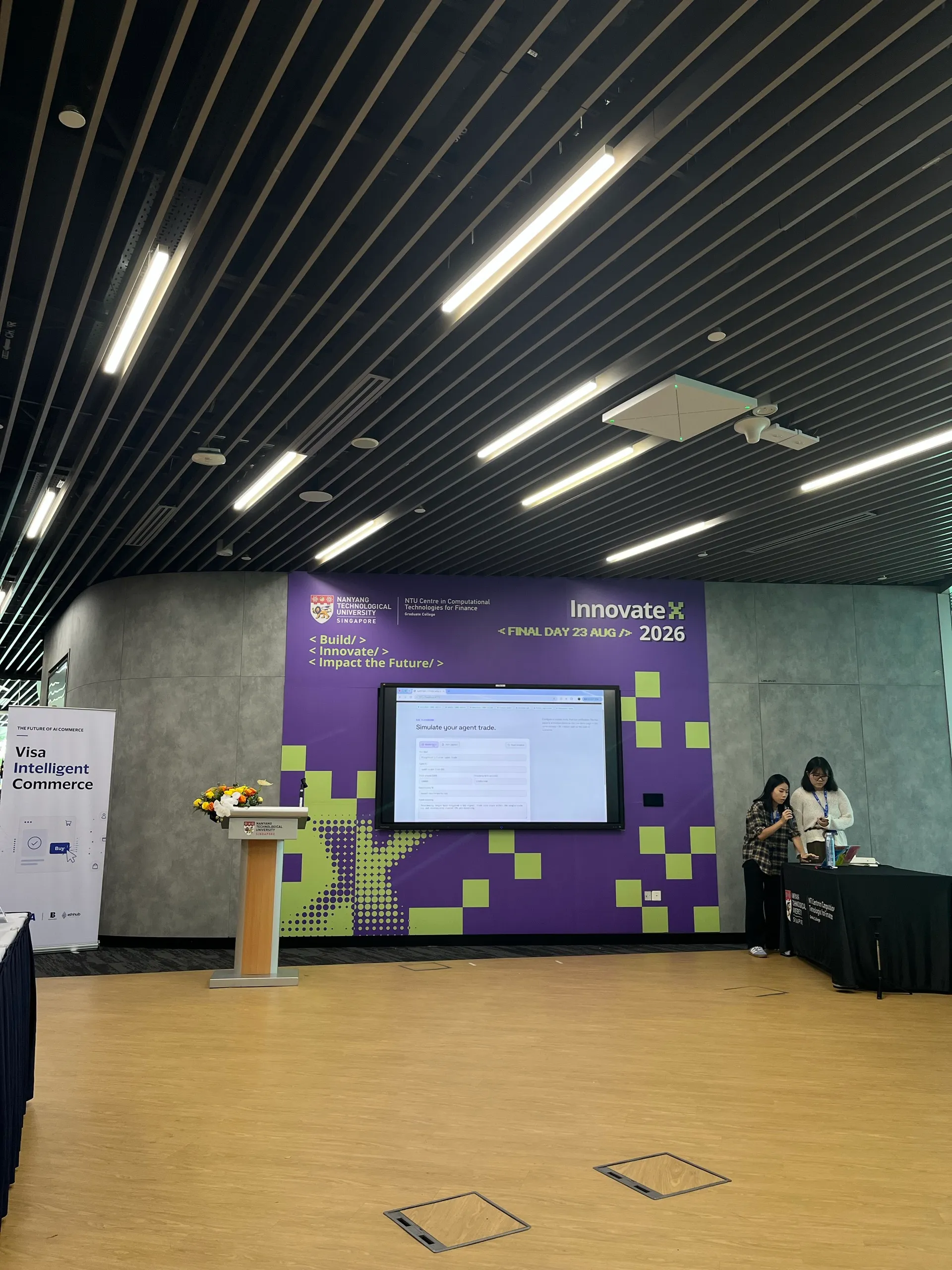 Another team presenting on the InnovateX final-day stage while we waited for slot six