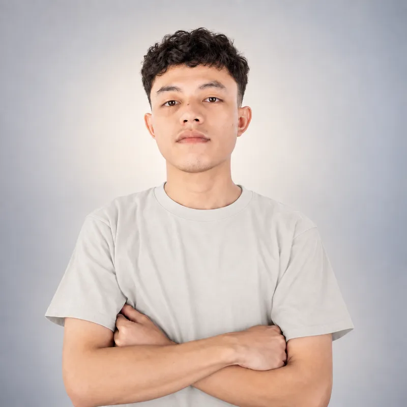 Rizki's studio portrait wearing a white T-shirt