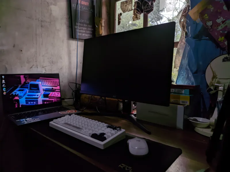 Rizki's second PC build, next to a laptop