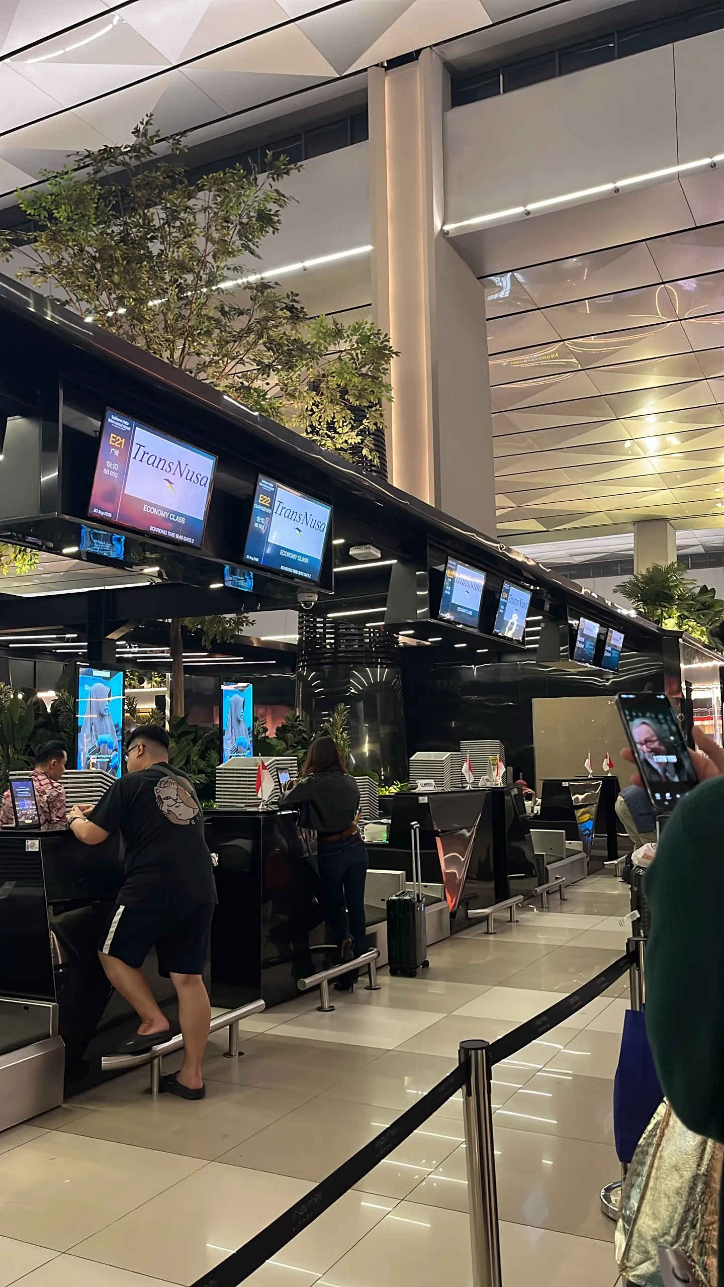 The check-in counters at Soekarno-Hatta airport at night